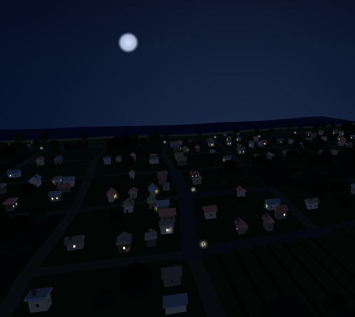 The same village at night, windows and street lights lit